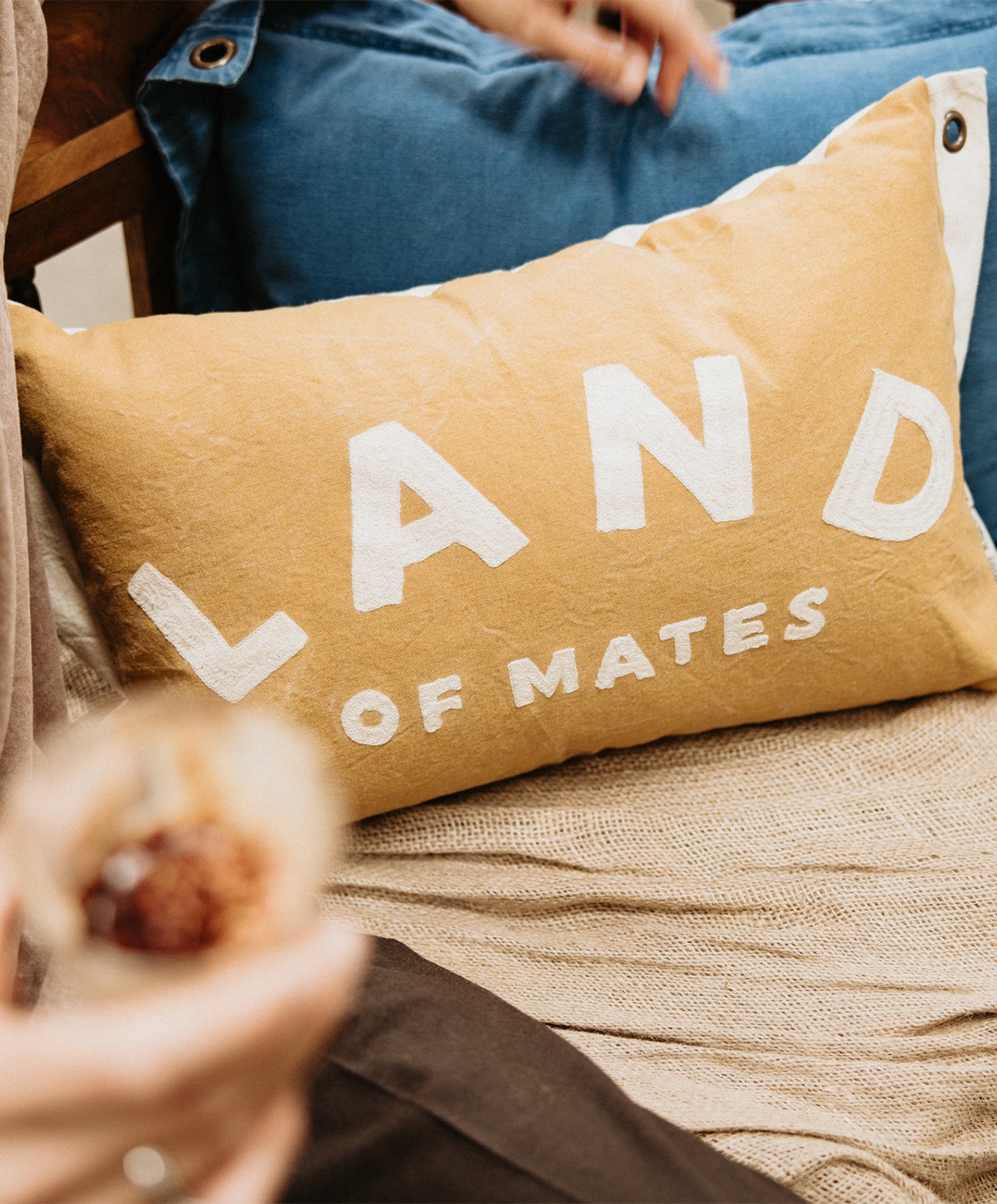 Land of Mates Cushion X Banner | Clay