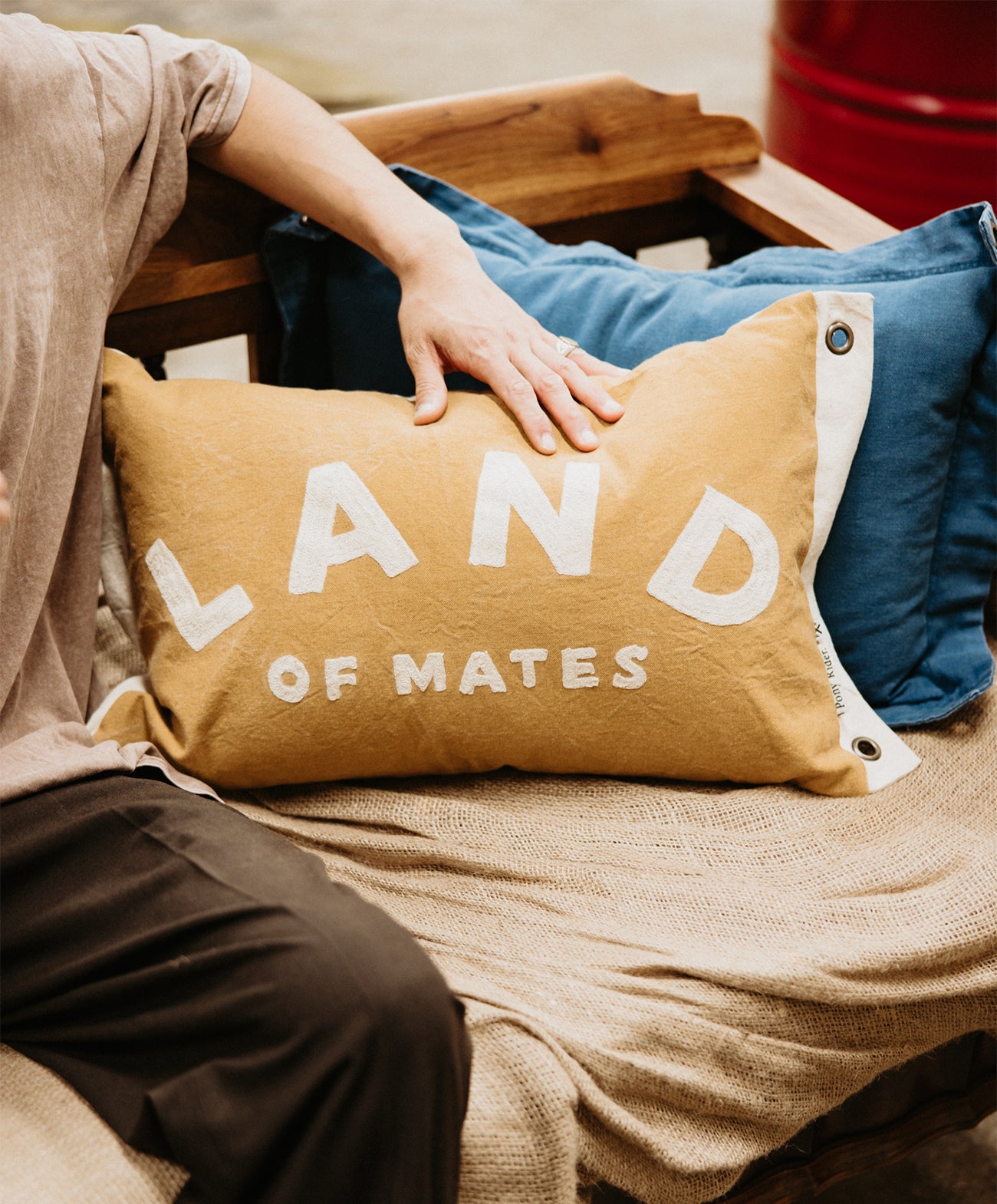 Land of Mates Cushion X Banner | Clay